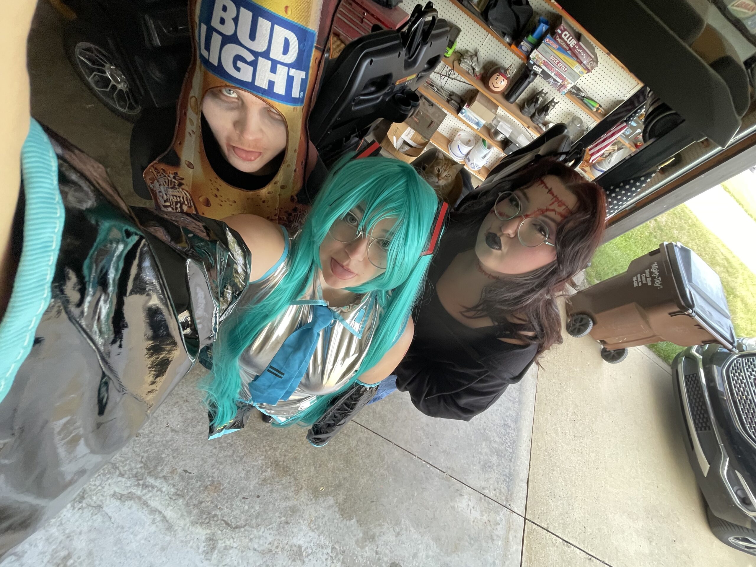 My friends and I on Halloween! I'm Hatsune Miku in the middle, Emily is on the right and Brandon is on the left.